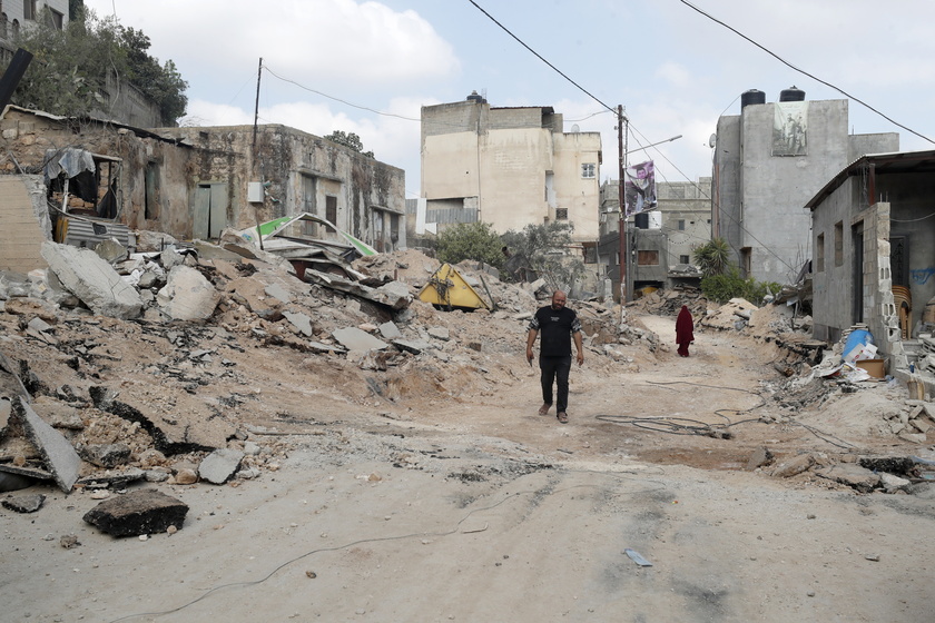 Palestinians inspect the damage after 9-day Israeli military operation in West Bank's Jenin